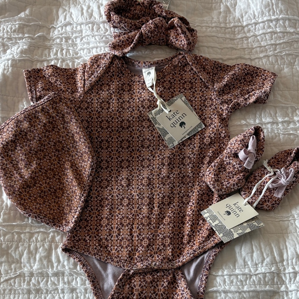 Kate Quinn plum mosaic baby onesie set